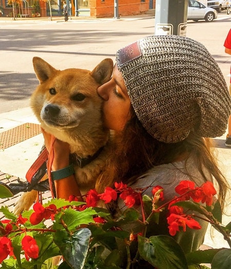 A picture of Emily absolutely loves dogs.